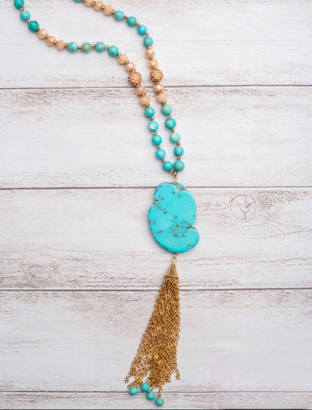 Turquoise slab with gold tassel necklace